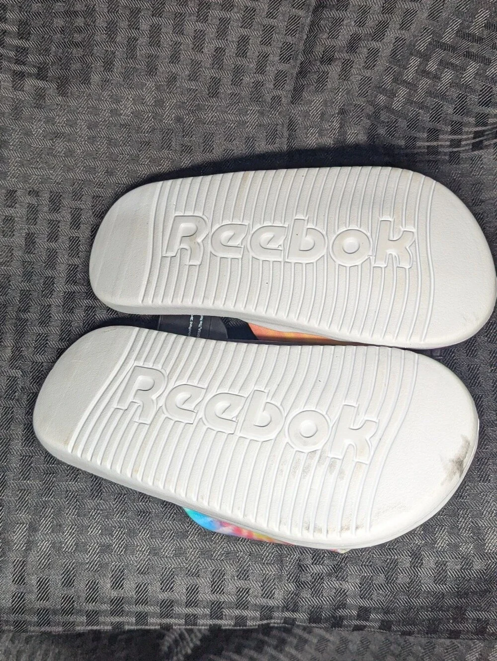 Aqua & Tie-Dye Reebok Slide Sandals.